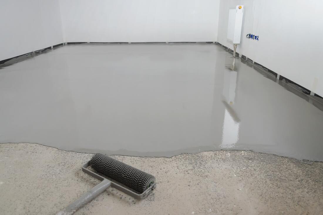 This picture shows concrete floor leveling work being done for a client in Coquitlam.